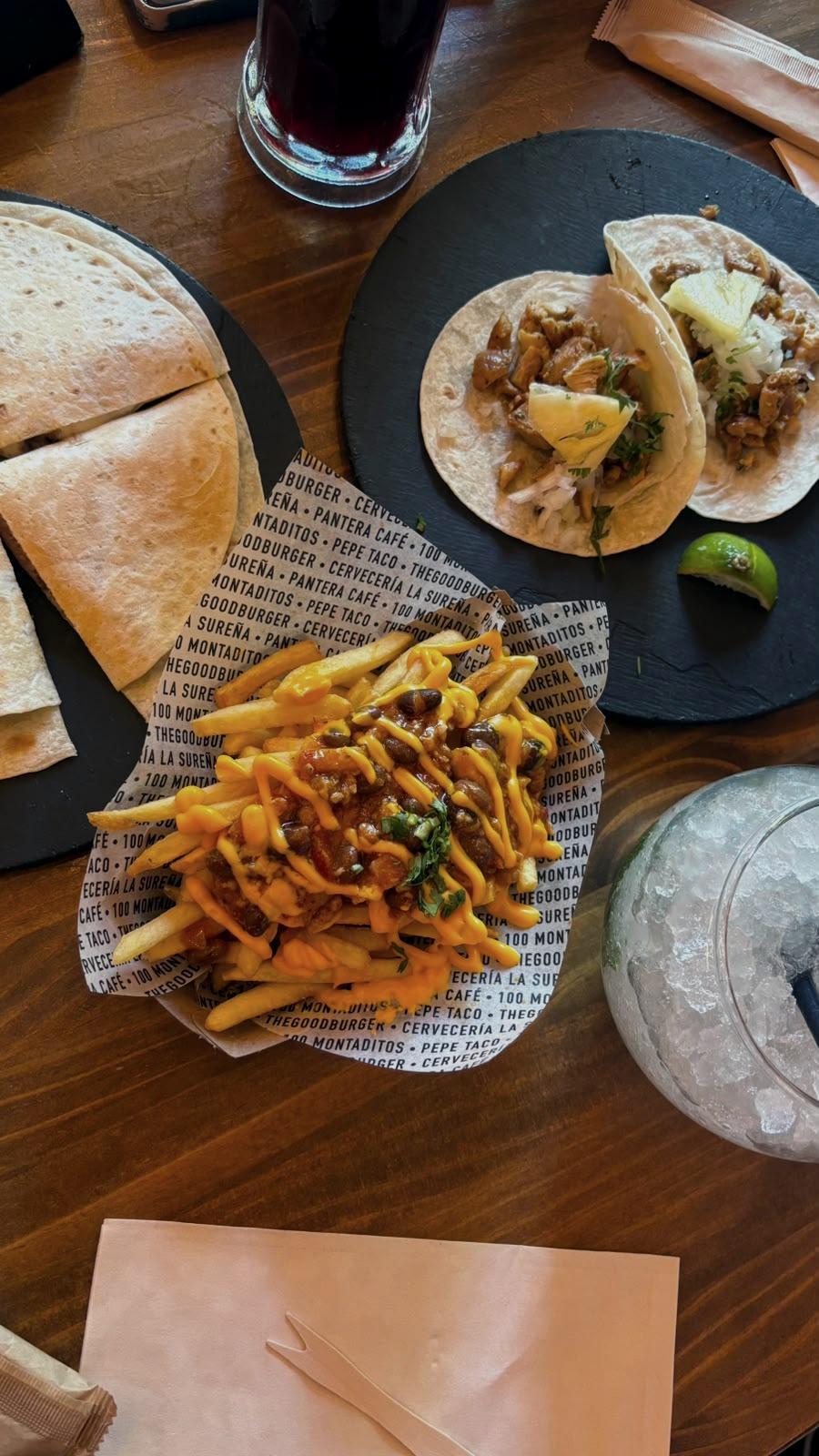 A shared table, halfway through the meal.